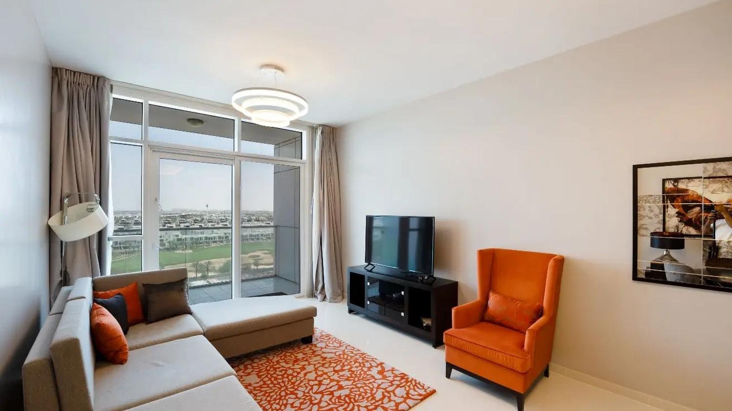 Living area with the golf course beyond the glazing