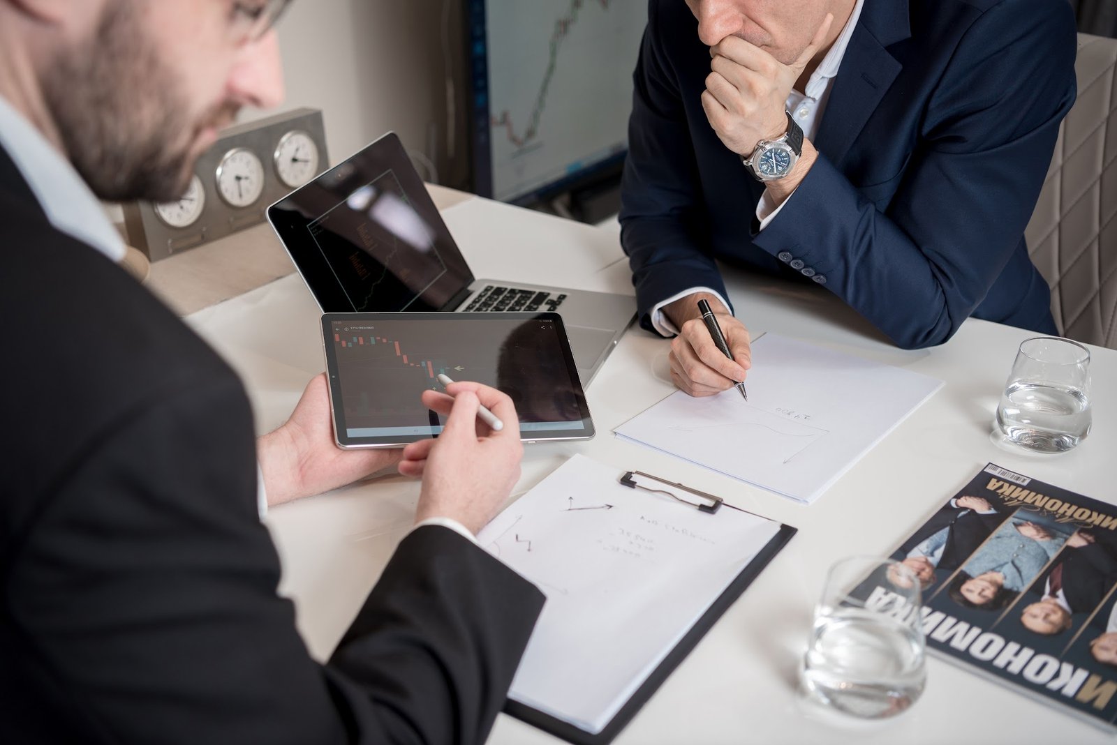 Advisers reviewing portfolio documents